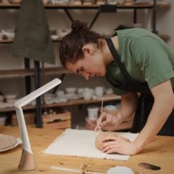 Daylight Company Smart Go Portable Lamp -ARTdiscount N1370 Smart Go AG 04 Decorating ceramic bowl in pottery workshop scaled 1